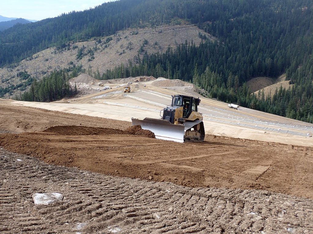 Bulldozer spreading clean soil at East Fork Nine Mile Waste Consolidation Area