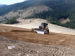 Bulldozer spreading clean soil at East Fork Nine Mile Waste Consolidation Area
