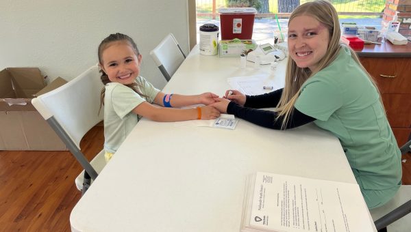 Little girl having her blood lead level tested